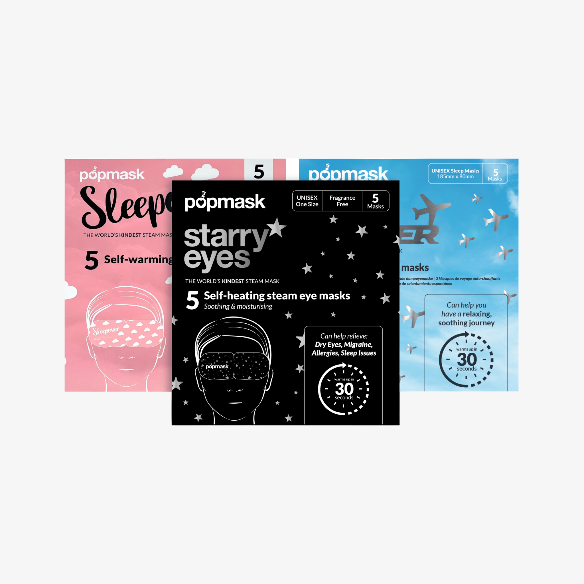 Three packages of Popmask self-heating eye masks. From left to right: pink with text 'Sleep', black with stars pattern and text 'Starry eyes', blue with text 'Jet setter'.